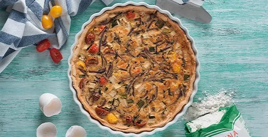 quiche de zapallo italiano tomatitos cherry y cebolla